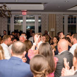 Guests celebrating joyfully at an elegant Beauport Hotel wedding reception in Gloucester, Massachusetts.