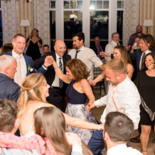 Guests dancing and celebrating at a joyful Beauport Hotel wedding in Gloucester, Massachusetts.