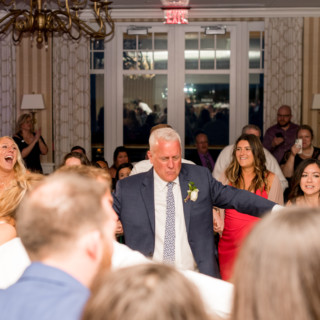 Father of the bride dancing joyfully at Beauport Hotel wedding reception in Gloucester, Massachusetts.