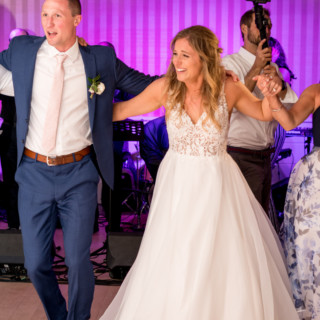 Bride and groom dancing joyfully at Beauport Hotel wedding in Gloucester, Massachusetts.