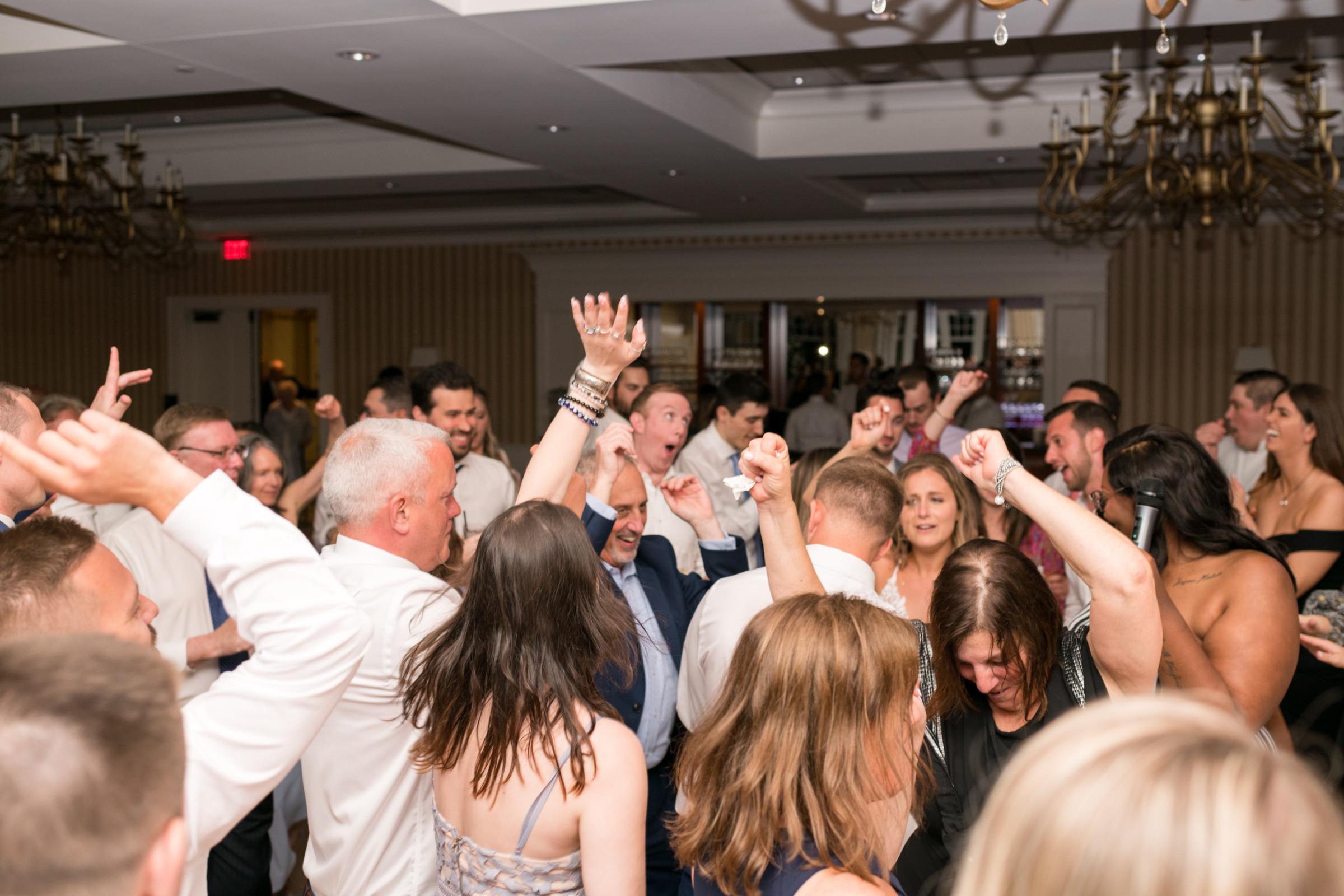 Guests dancing and celebrating at a lively Beauport Hotel wedding reception in Gloucester, MA.