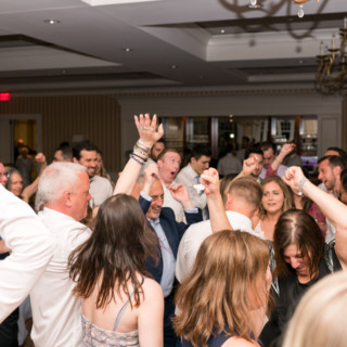 Guests dancing and celebrating at a lively Beauport Hotel wedding reception in Gloucester, MA.