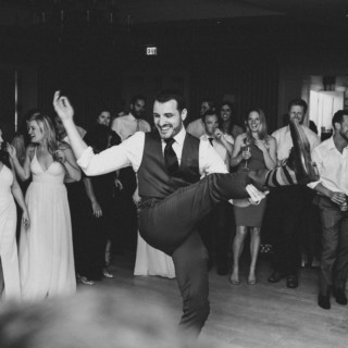 Man dancing joyfully at elegant Beauport wedding celebration in Gloucester, Massachusetts.