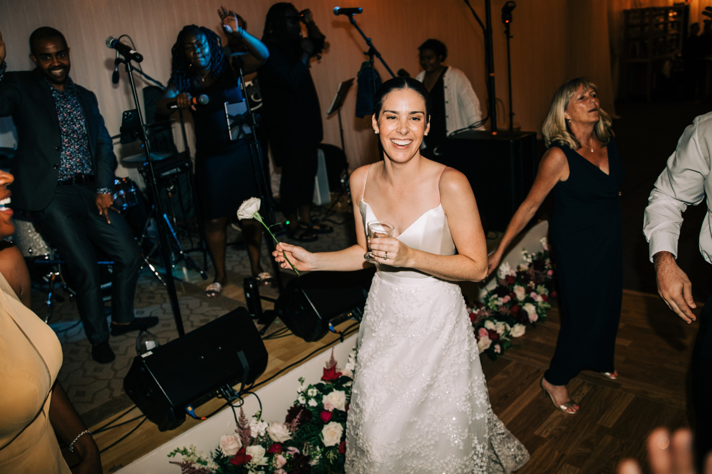 Bride dancing joyfully with guests at elegant Hildene wedding in Manchester, Vermont.