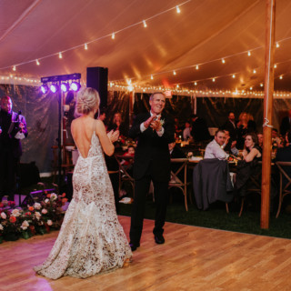 Father-daughter dance under glowing tent at Toad Hill Farm wedding in Franconia, New Hampshire.