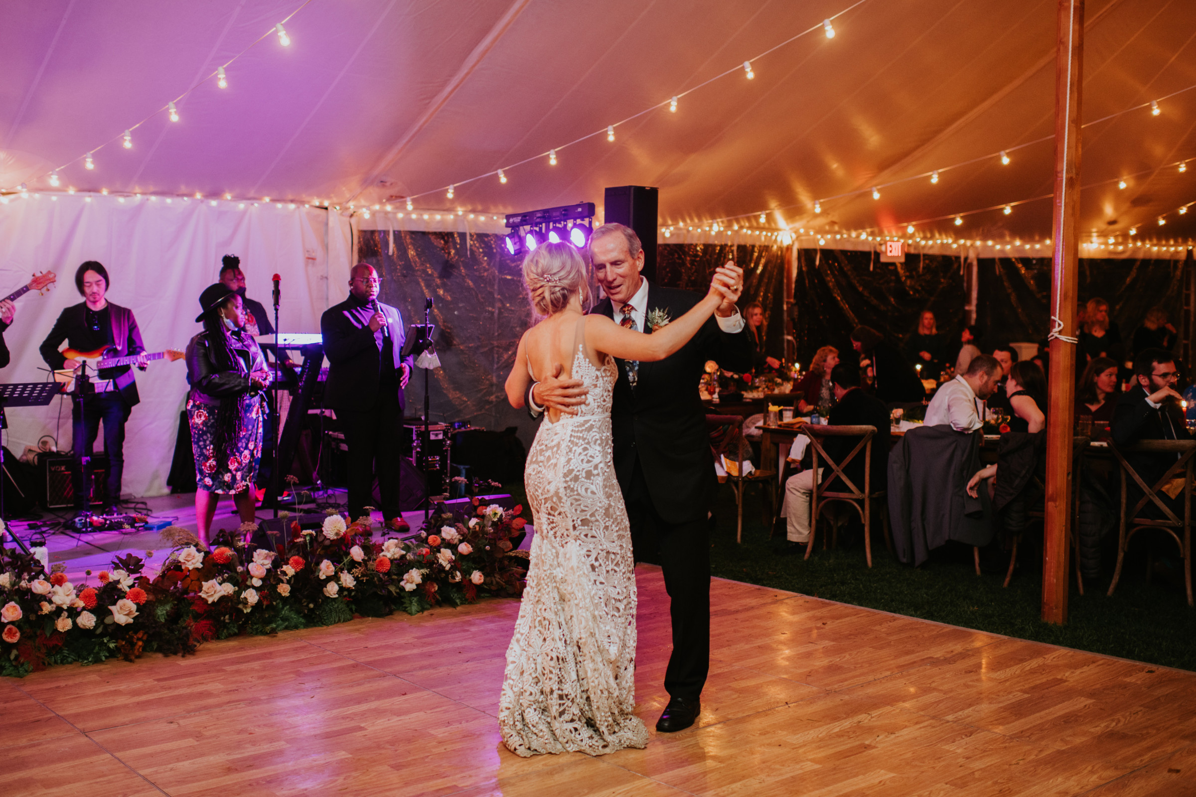 Father-daughter dance at rustic Toad Hill Farm wedding under romantic string lights in Franconia, NH.