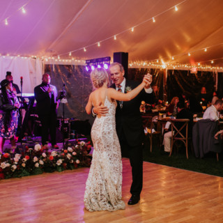 Father-daughter dance at rustic Toad Hill Farm wedding under romantic string lights in Franconia, NH.