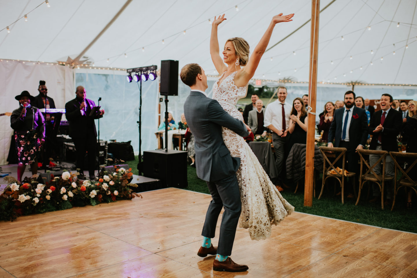Bride and groom’s joyful first dance under string lights at Toad Hill Farm wedding, Franconia NH.