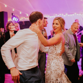 Bride and groom dancing joyfully at Toad Hill Farm wedding in Franconia, New Hampshire.