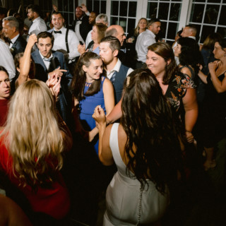 Guests dancing and celebrating at a joyful Wychmere Beach Club wedding reception in Harwich Port, MA.