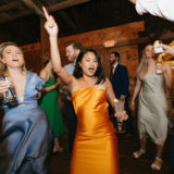 Guests dancing joyfully at rustic Shady Lane Farm wedding in New Gloucester, Maine.