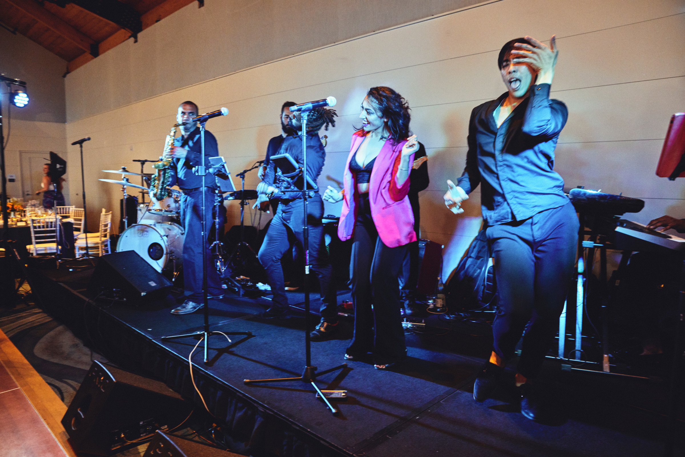 Energetic live band performing indoors at a wedding celebration in Ogunquit, Maine.