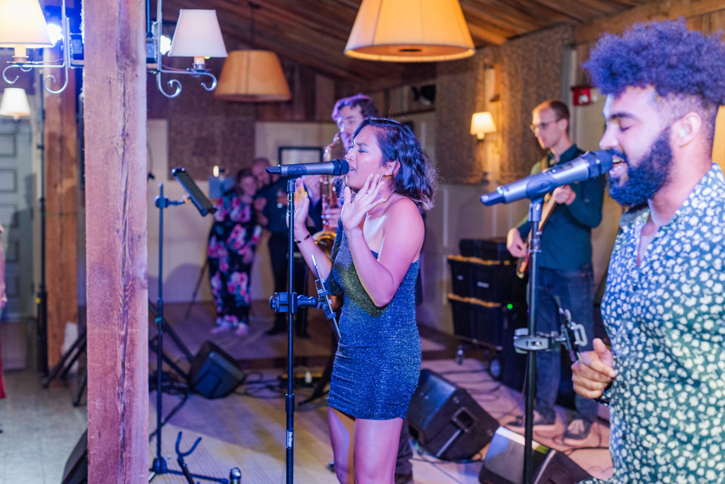 Energetic live band performing at rustic indoor wedding reception in Groton, Massachusetts.