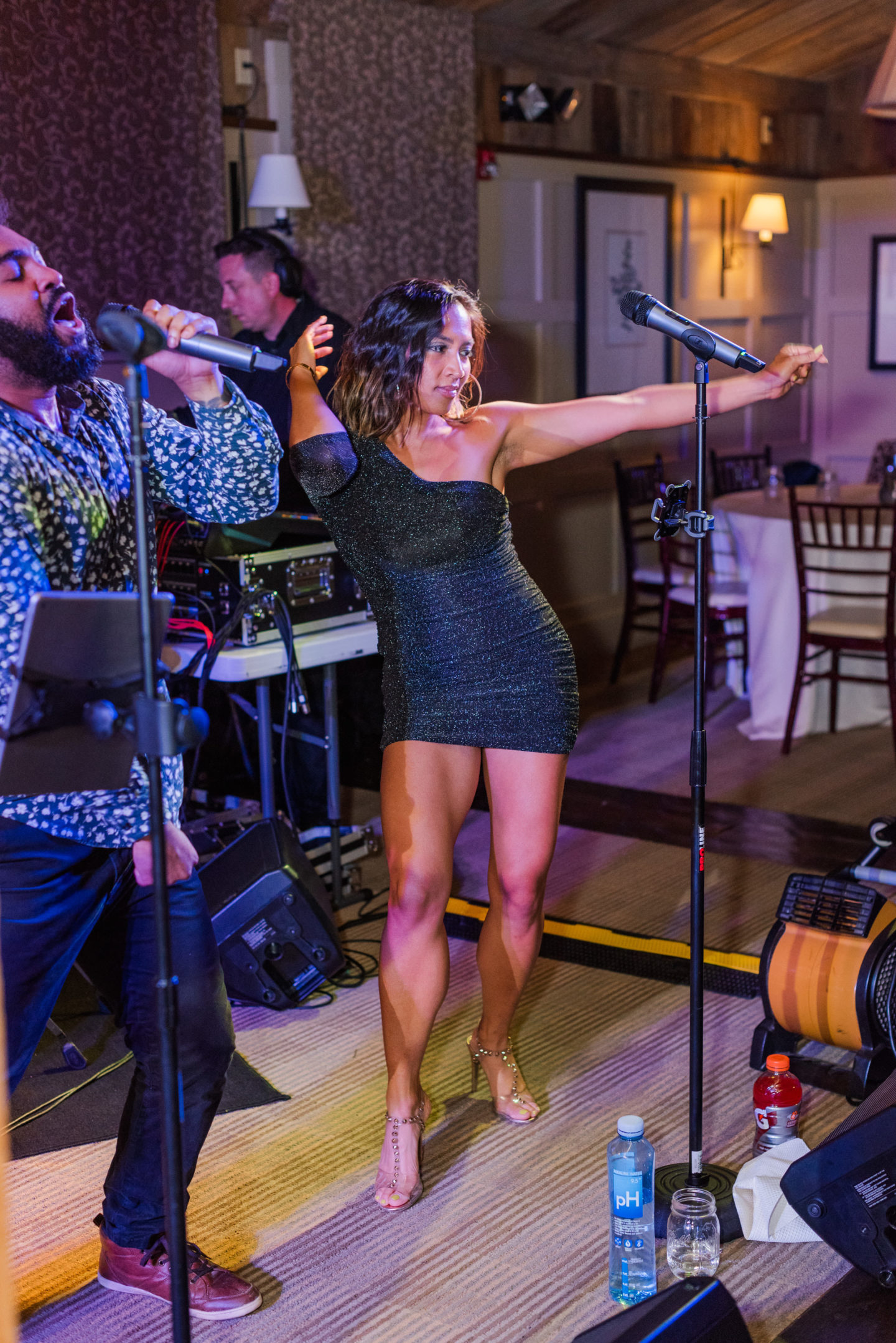 Bride lifted on a chair during joyful rustic wedding celebration at Gibbet Hill, Groton MA.