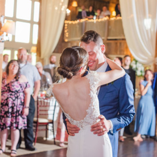 Bride and groom share a romantic first dance at a rustic barn wedding in Groton, Massachusetts.