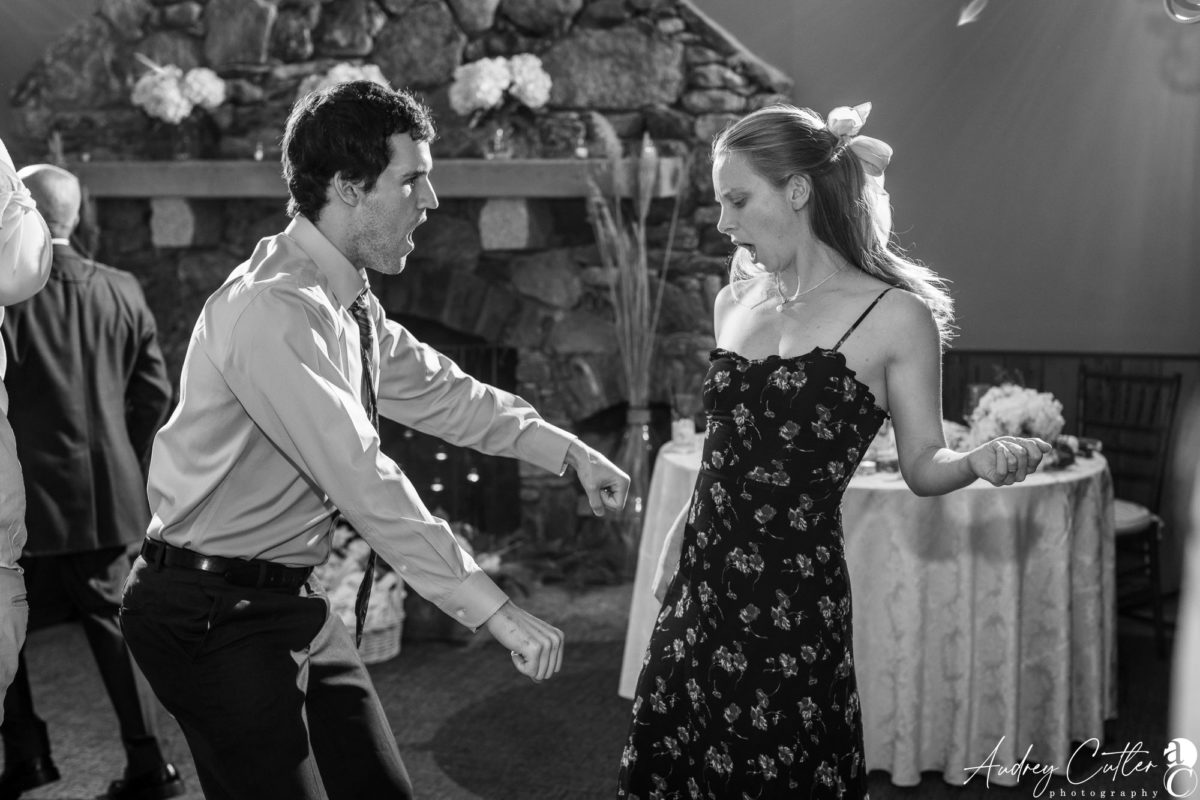 Joyful couple dancing at rustic Harrington Farm wedding in Princeton, Massachusetts.