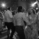 Couple dancing joyfully at rustic Harrington Farm wedding reception in Princeton, Massachusetts.