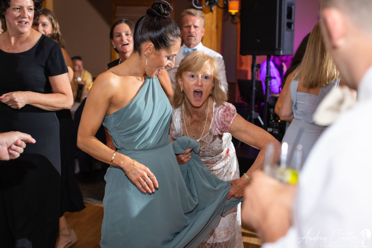 Guests dancing and laughing at a joyful Harrington Farm wedding in Princeton, Massachusetts.