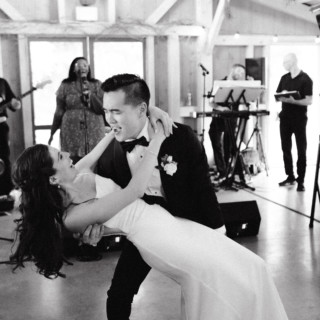 Bride and groom share a joyful first dance at Marianmade Farm wedding in Wiscasset, Maine.