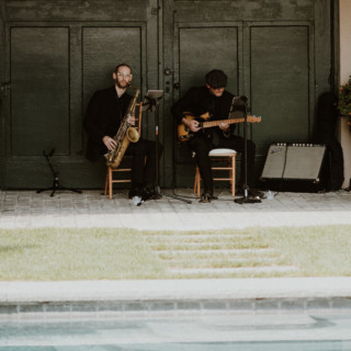 Poolside jazz duo performing at rustic farm wedding in Manchester, Vermont.