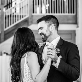 Bride and groom share joyful first dance at rustic Barn at Gibbet Hill wedding.