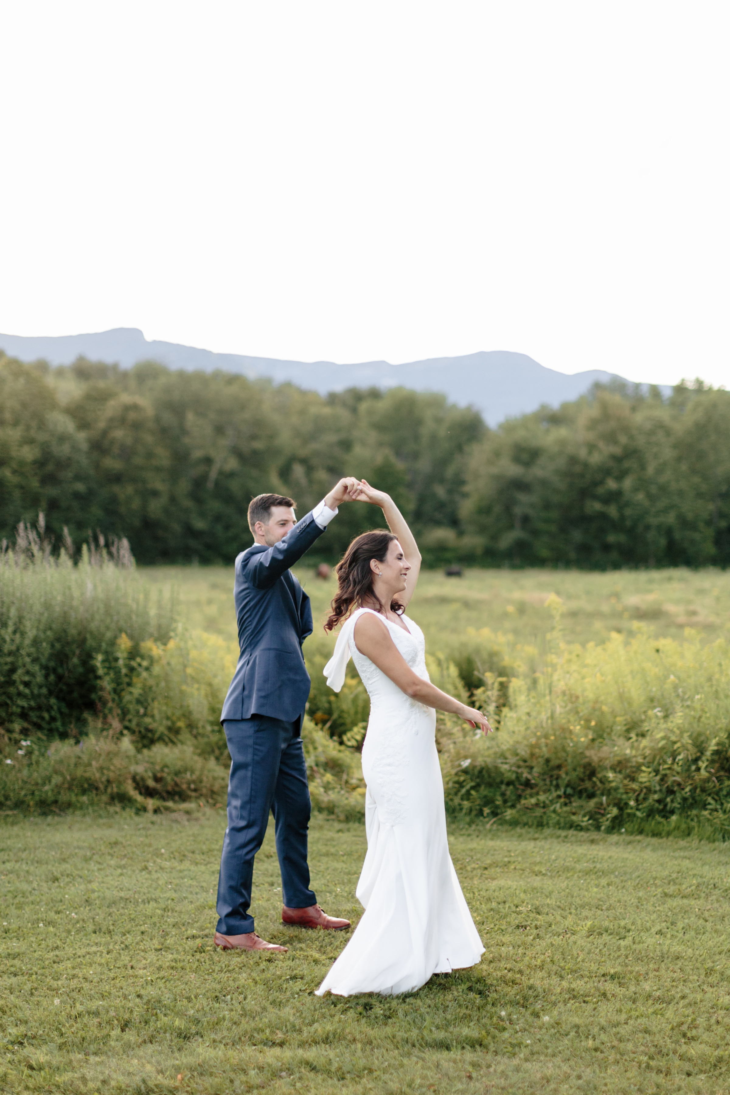 Bride and groom dancing outdoors at Topnotch Resort wedding in Stowe, Vermont.