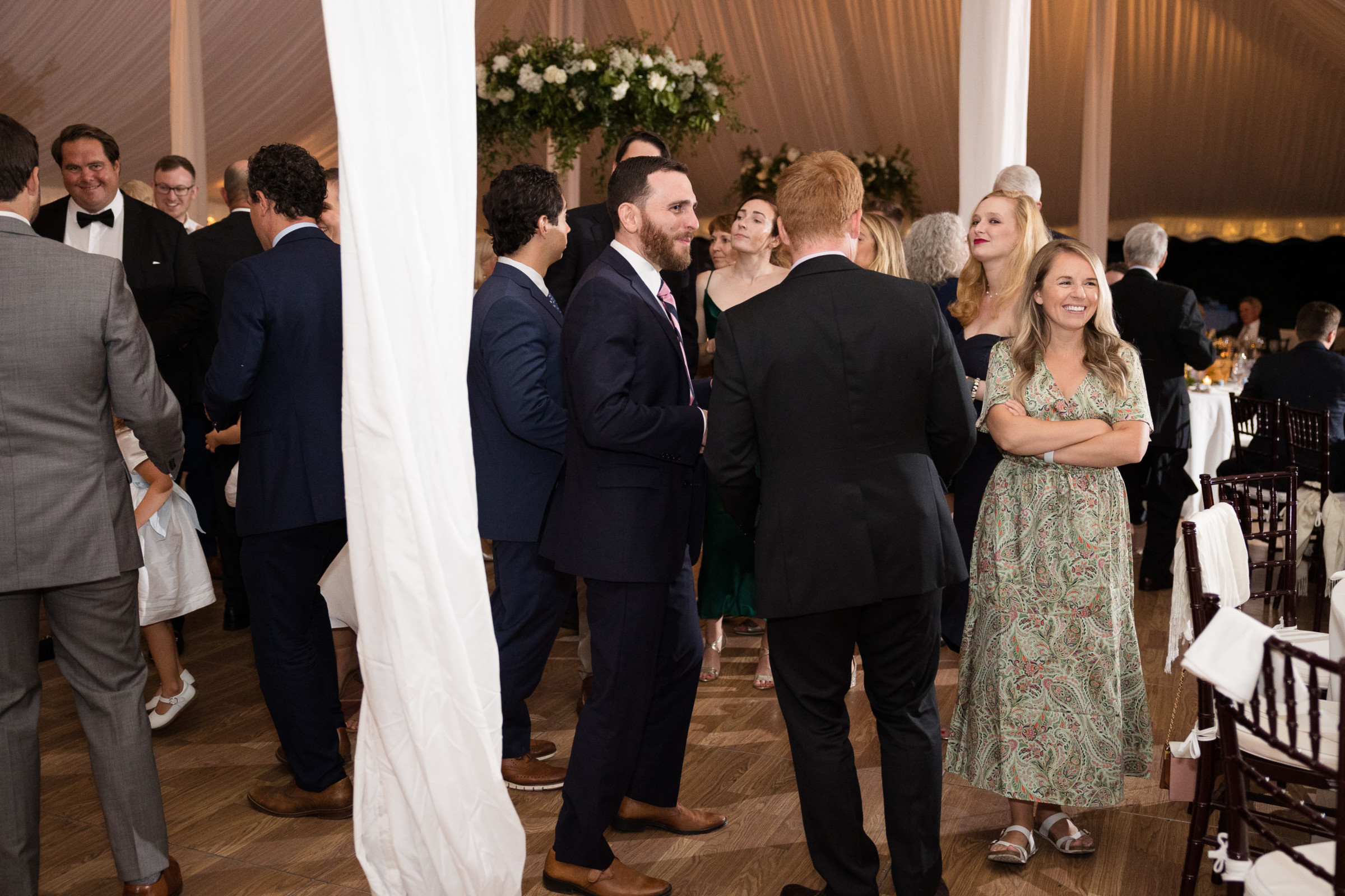 Elegant wedding reception under a white tent at Topnotch Resort in Stowe, Vermont.