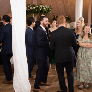 Elegant wedding reception under a white tent at Topnotch Resort in Stowe, Vermont.