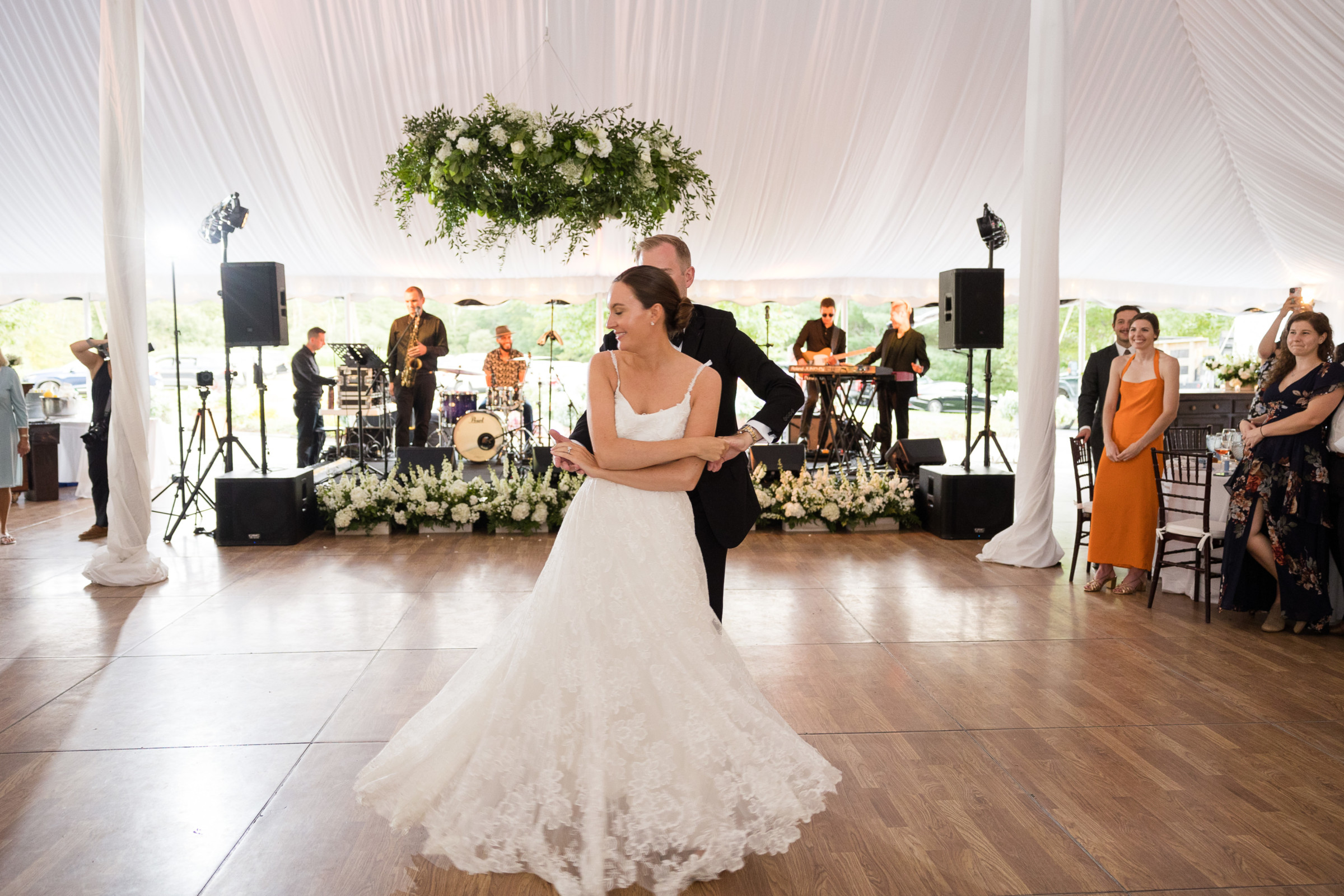 Bride and groom share a romantic first dance under elegant white tent at Topnotch Resort wedding.