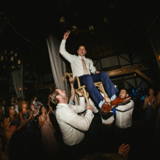 Groom lifted during lively Hora dance at rustic Valley View Farm wedding celebration.