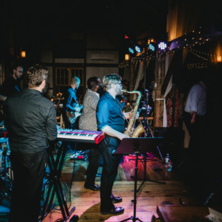 Live band performing at rustic barn wedding reception in Haydenville, Massachusetts.