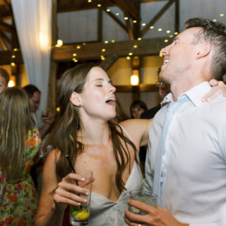 Bride and groom singing joyfully at rustic Valley View Farm wedding in Haydenville, Massachusetts.