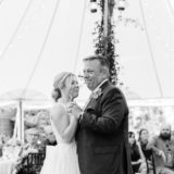 Bride and father share emotional dance under fairy lights at Willowdale Estate wedding reception.