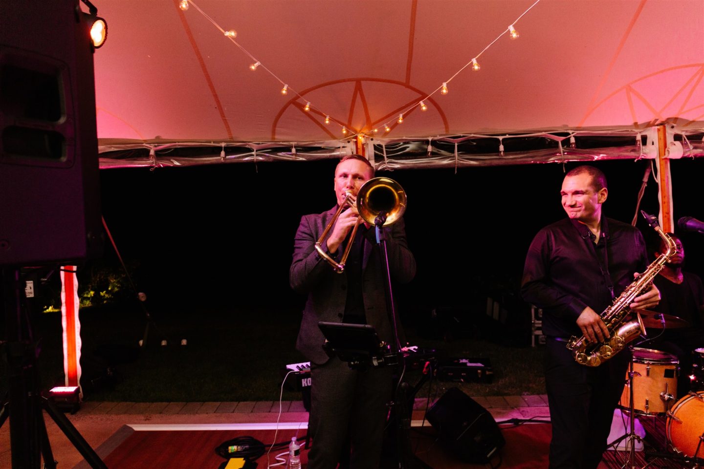 Bride and groom share romantic first dance under glowing canopy at Willowdale Estate wedding.