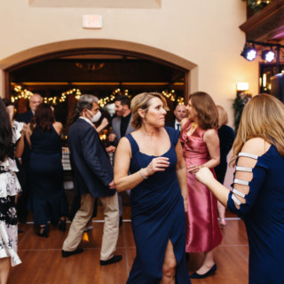 Guests dancing joyfully at an elegant Willowdale Estate wedding reception in Topsfield, Massachusetts.
