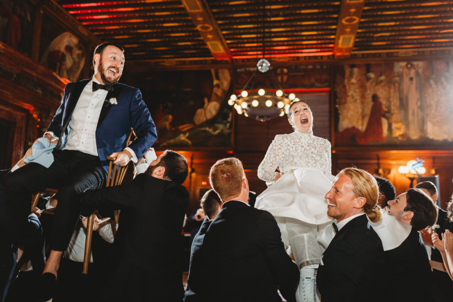 Elegant wedding dinner beneath grand vaulted ceilings at the historic Boston Public Library.