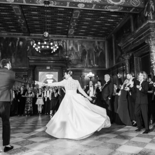 Bride and groom share elegant first dance in grand Boston Public Library ballroom.