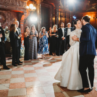 Newlyweds share their first dance at an elegant Boston Public Library wedding reception.