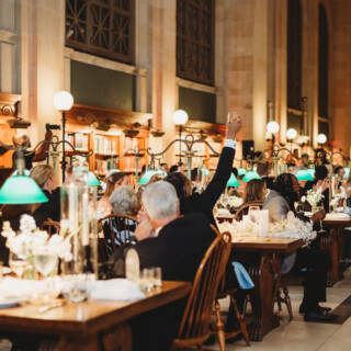 Elegant wedding reception in the grand reading room of the Boston Public Library.