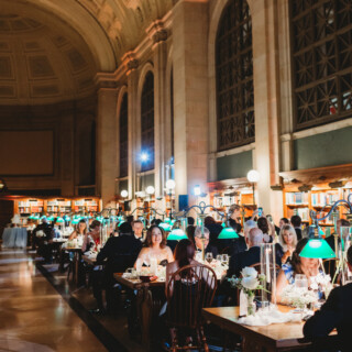 Elegant wedding dinner beneath grand vaulted ceilings at the historic Boston Public Library.