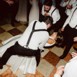 Bride and groom share a joyful dance at their Boston Public Library wedding reception.