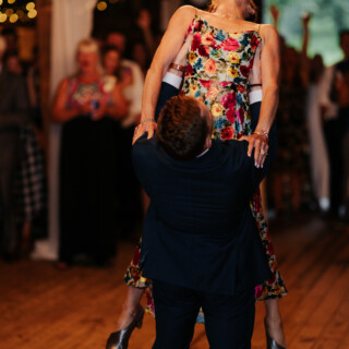 Bride and groom dance lift at rustic Cunningham Farm wedding in New Gloucester, Maine.