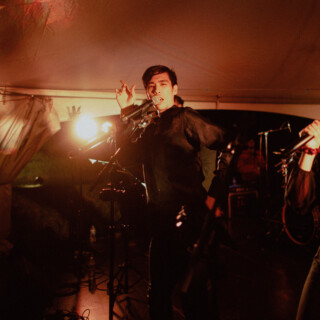 Energetic live band performing under warm lights at a Yellowstone Club wedding in Big Sky, Montana.