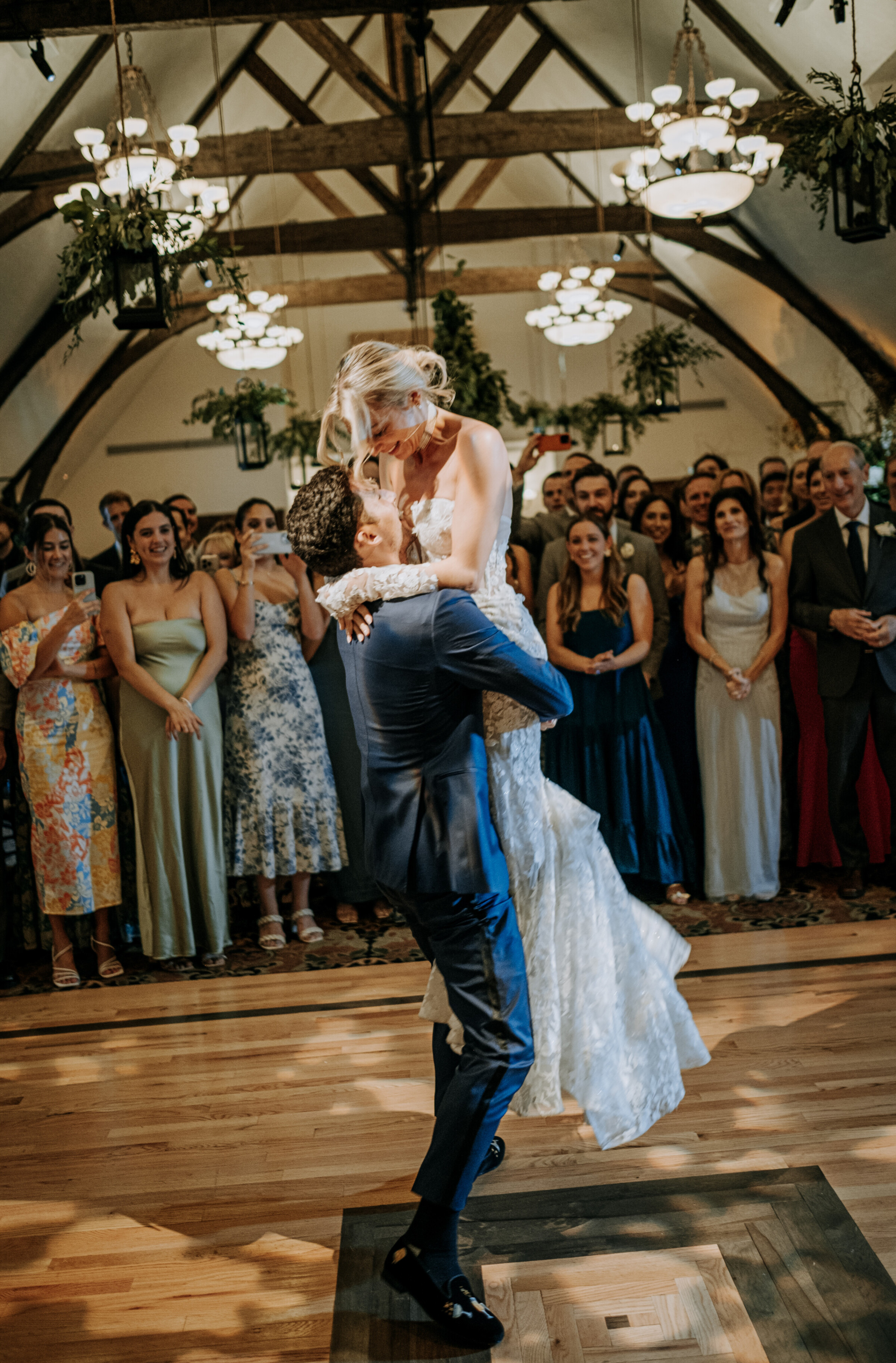Bride and groom share a joyful dance surrounded by cheering guests at Bar Harbor Club wedding.