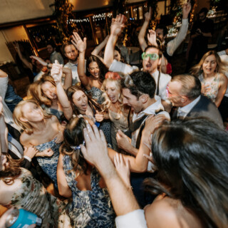 Guests celebrating on a lively wedding dance floor at Bar Harbor Club, Maine.