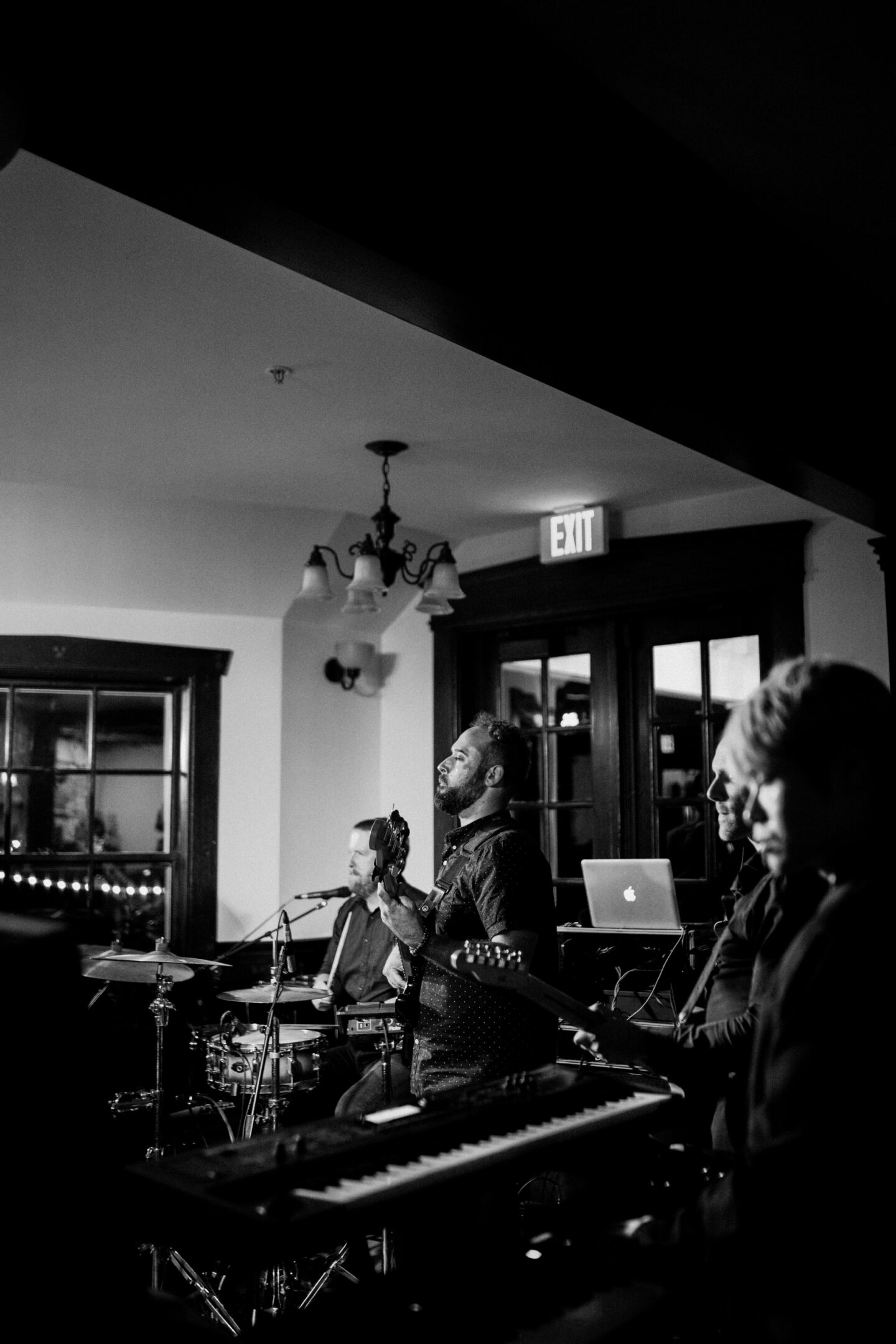 Bride and groom cutting elegant floral wedding cake at French’s Point in Stockton Springs, Maine.