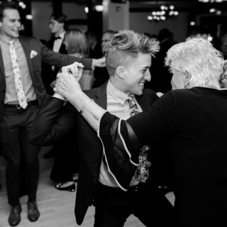 Joyful black-and-white wedding dance between generations at French’s Point in Stockton Springs, Maine.