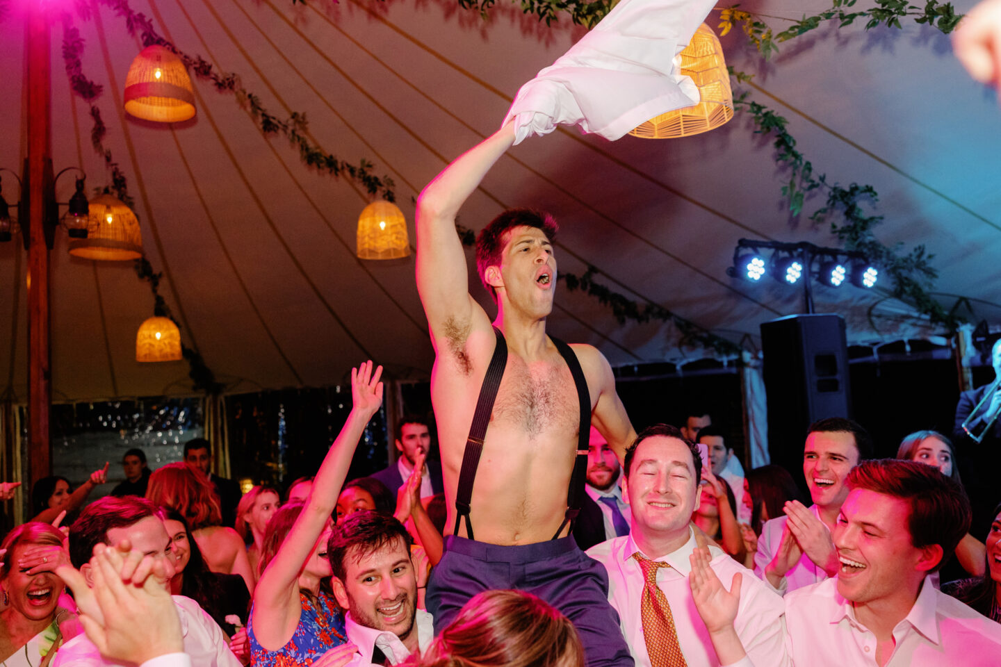 Bride and groom lifted during joyful Hora dance at Willowdale Estate wedding in Topsfield, Massachusetts.