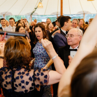 Guests dancing and celebrating joyfully at a lively Willowdale Estate wedding in Topsfield, Massachusetts.