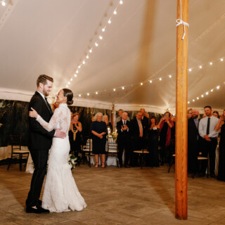 Bride and groom share a romantic first dance under warm lights at Bradley Estate wedding.